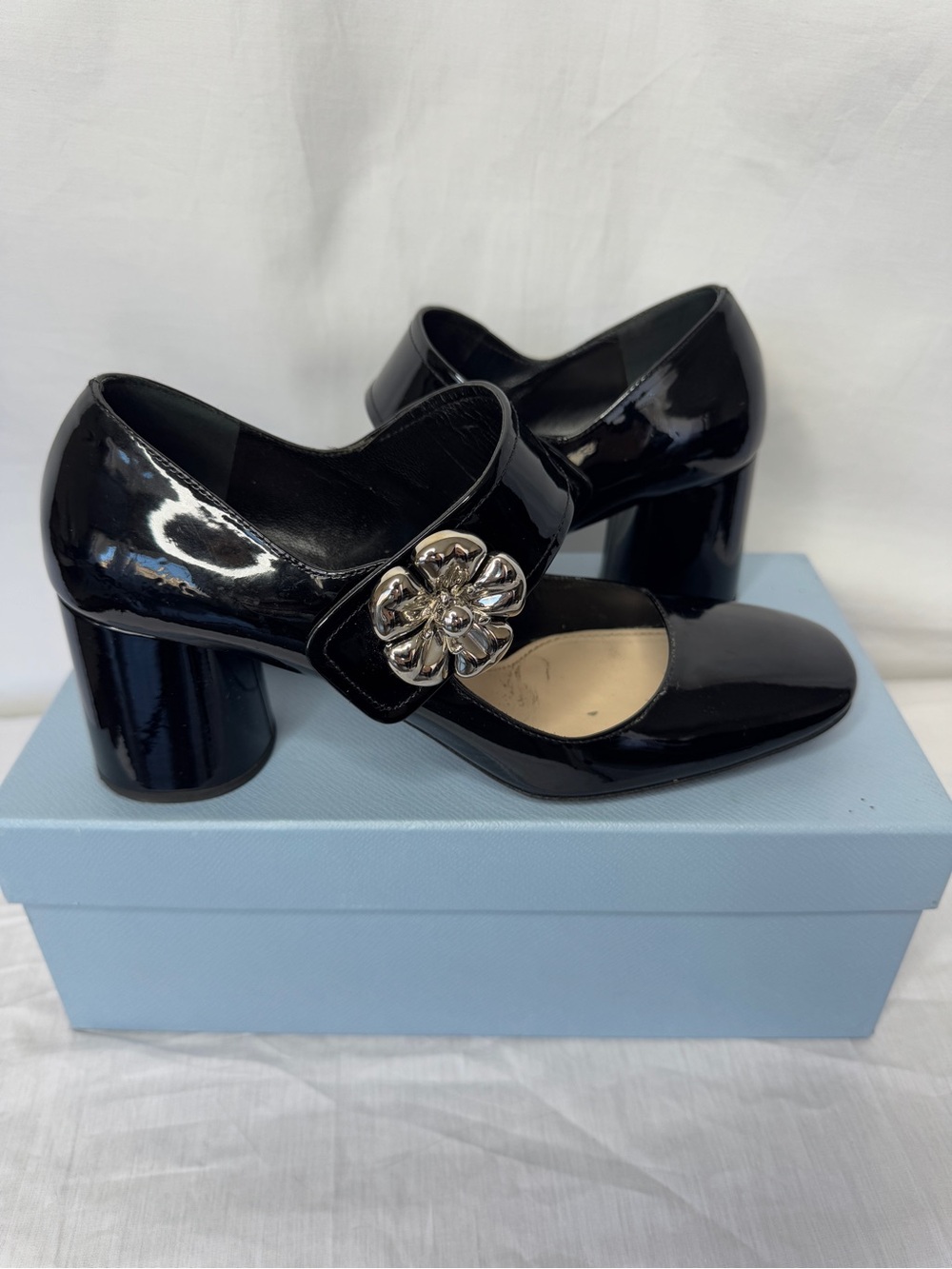 Prada Black Patent Mary Jane Block Heel Pumps with Silver Flower Detail